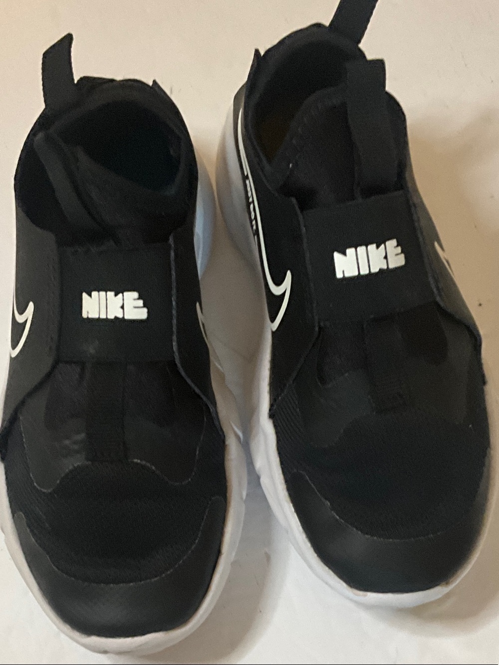 Nike Kids Black and White Slip-On Sneakers